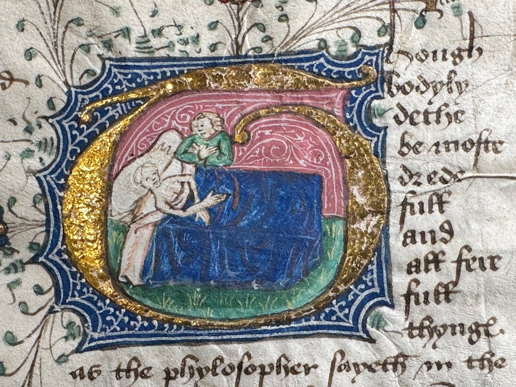 A gold and blue illuminated initial in a fifteenth-century manuscript, enclosing a deathbed scene: a figure in bed under a blue coverlet, a soul or angel above, with green penwork sprays around the letter