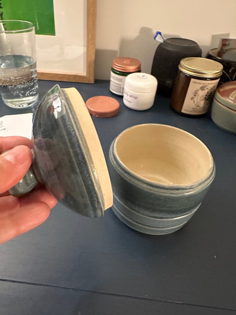 The lidded jar opened, showing the unglazed inner flange of the lid
